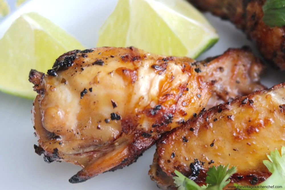 Spicy Grilled Chicken Wings with Tropical Salsa are a bit fiery and a lot delicious! Serve with some tortilla chips and give your taste buds a fiesta!