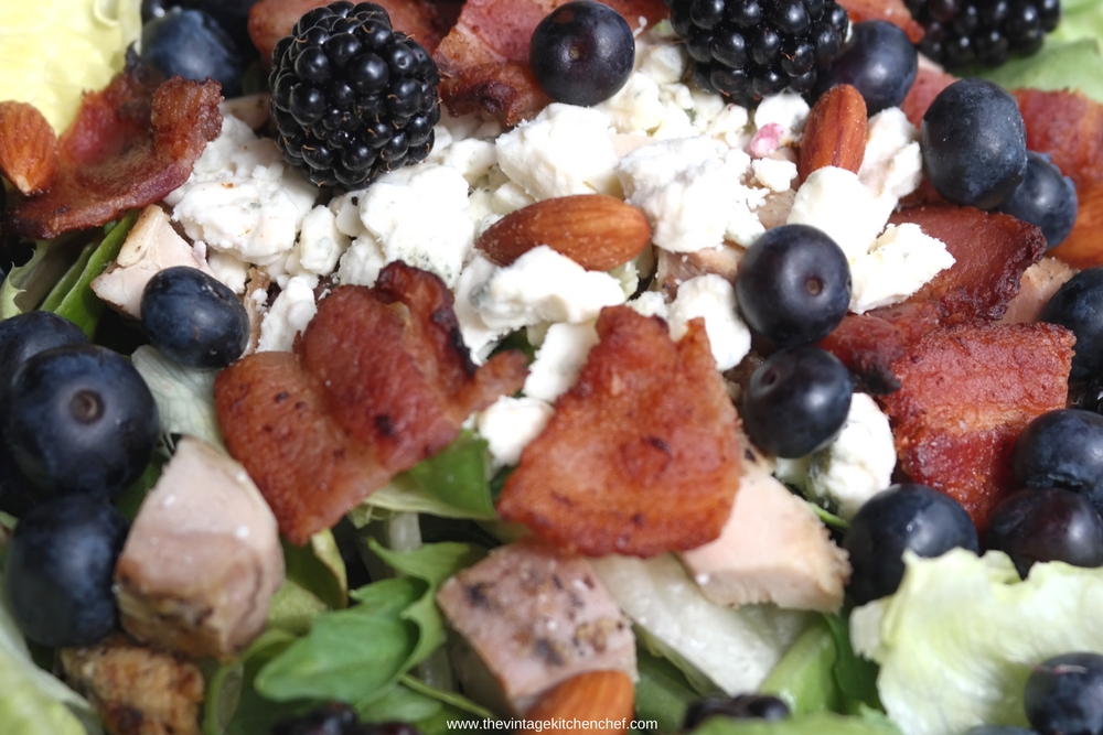 Smoky Black and Blue Salad combines luscious berries, grilled chicken, smoked almonds, and smoky bacon to get salad perfection!
