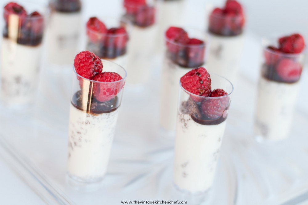 Easy Raspberry Dream Mini Parfaits begin with bites of chocolate cake mingled with creamy Italian custard, fresh raspberries and a touch of chocolate syrup.